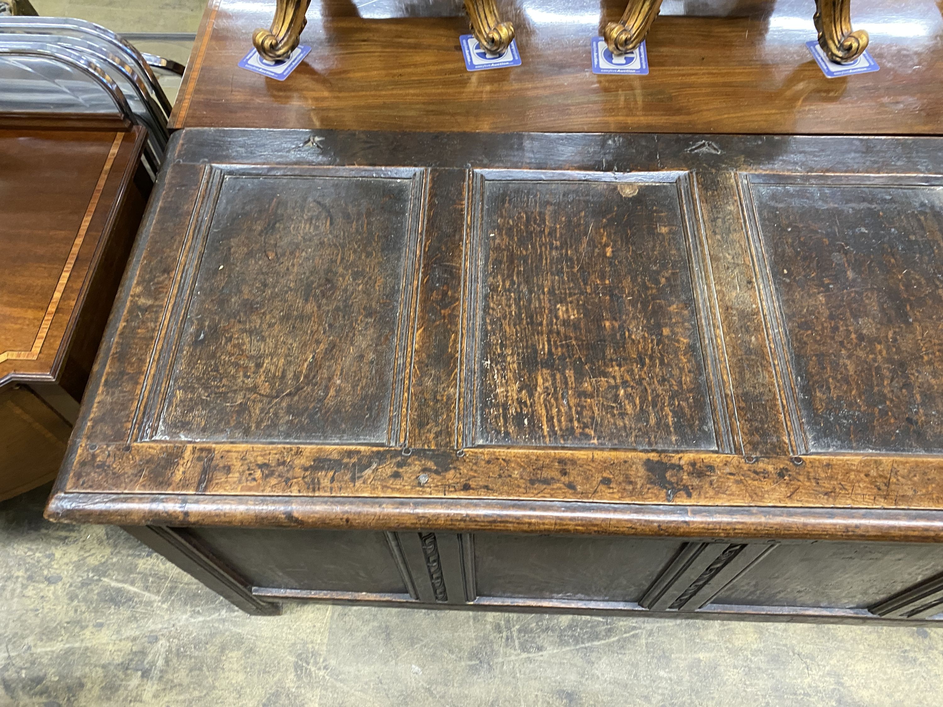 An 18th century panelled oak coffer, length 168cm, depth 63cm, height 75cm